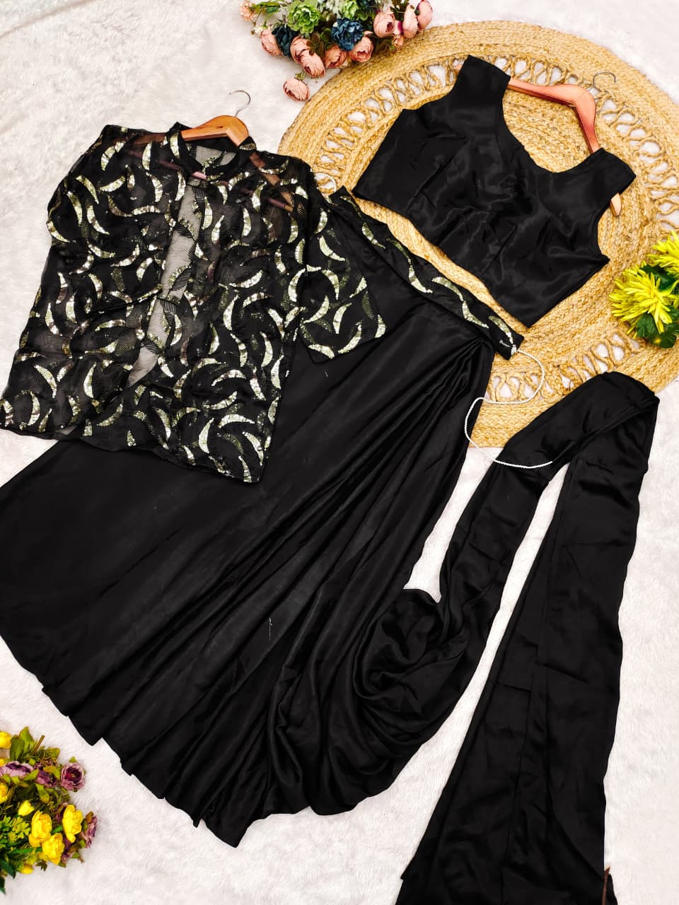 Close up view of detailed multi-thread embroidery work and shimmering sequence detailing on black organza jacket - WishTown Fashion Club