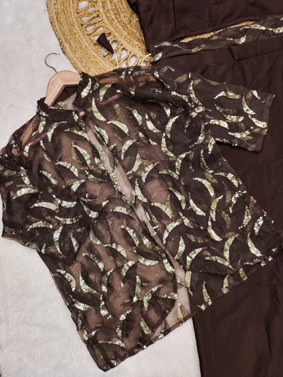 Detailed view of coffee brown fully stitched chinnon silk blouse highlighting size forty-two to forty-four margin construction - WishTown Fashion Club