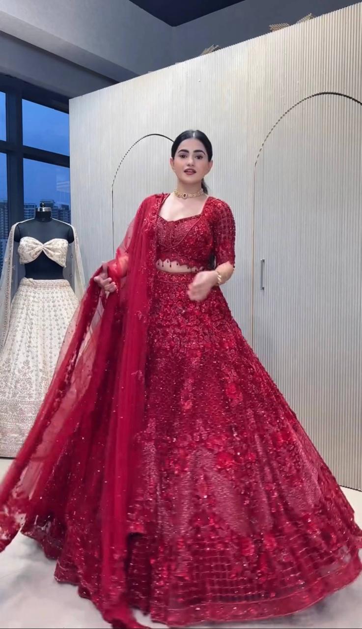 Front view of dark pink net sequins pearl beads lehenga choli with matching unstitched blouse piece - WishTown Fashion Club