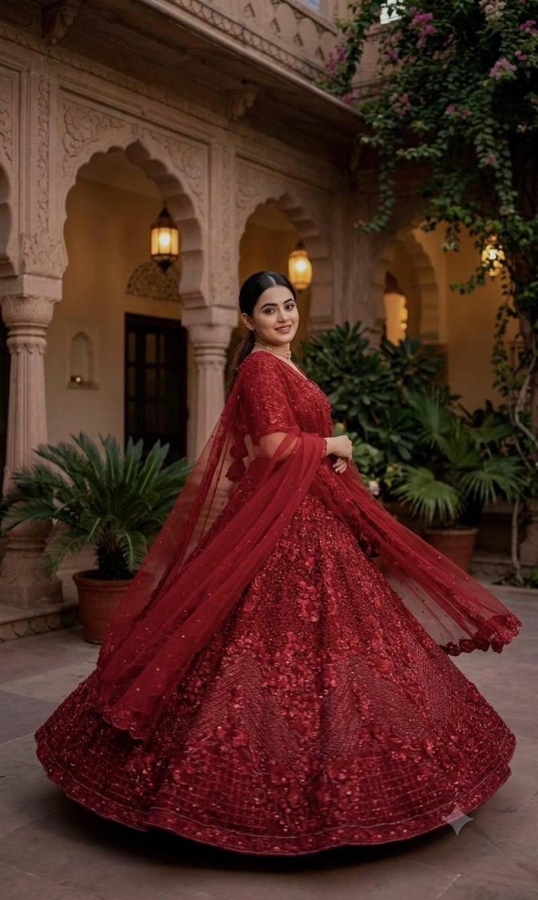 Close up view of thread work dori embroidery sequins and pearl beads on red net lehenga panels - WishTown Fashion Club