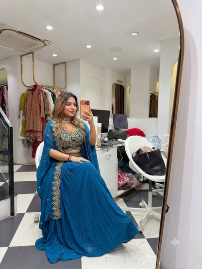 Front view of teal blue party wear shrug with sarara set with front embroidered blouse - WishTown Fashion Club