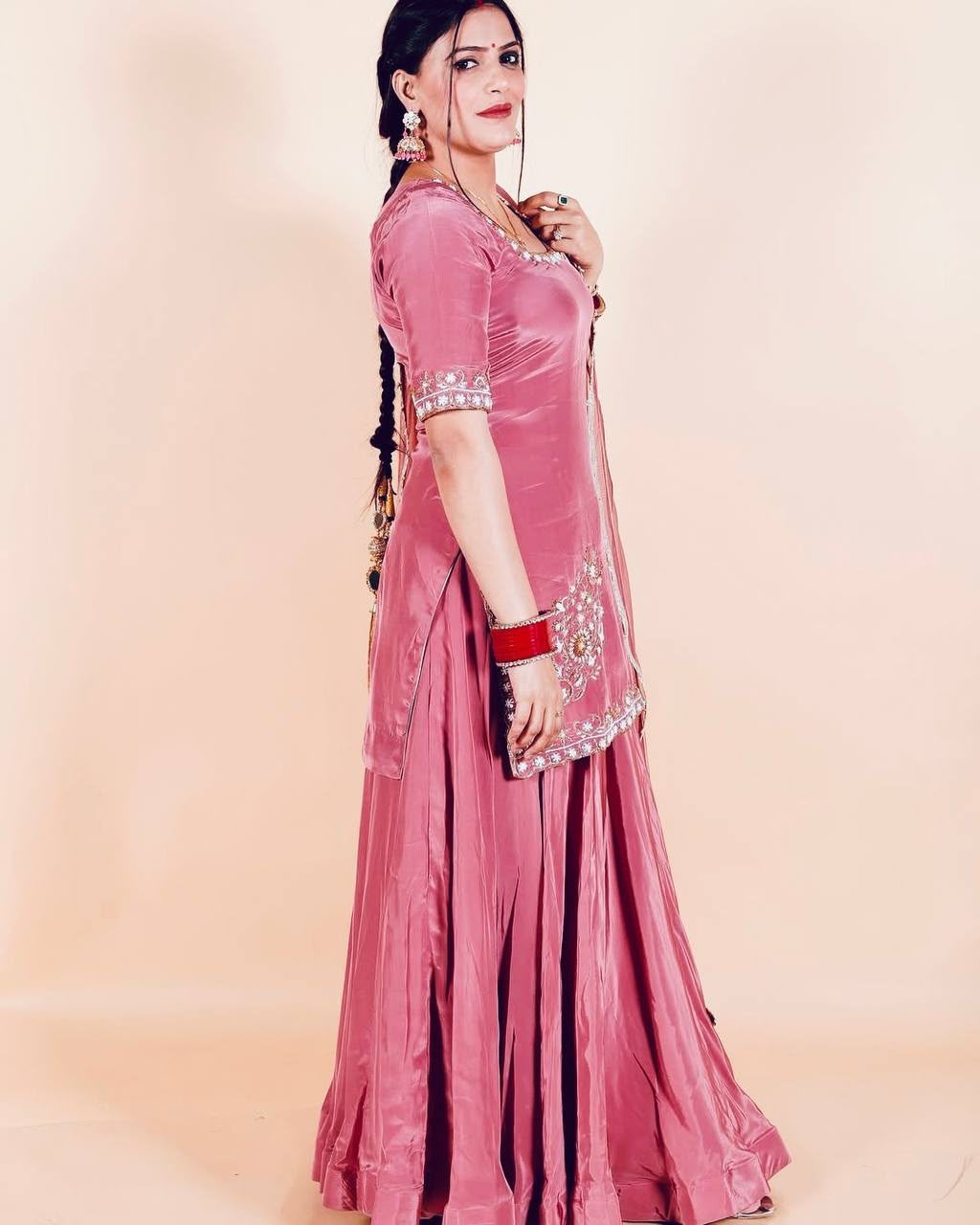 Close up view of detailed embroidered sequence work on pink heavy natural creap top bodice - WishTown Fashion Club