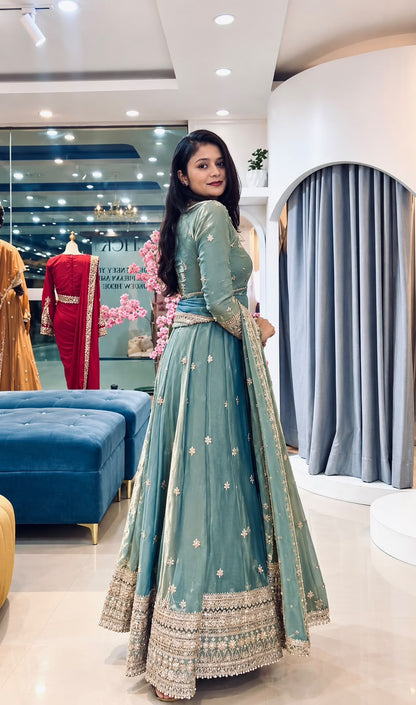 Wide angle presentation highlighting fully flared twirl silhouette of forty-eight to forty-nine inch sea green gown - WishTown Fashion Club
