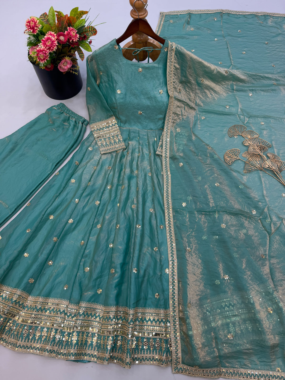 Close up view of detailed sequence embroidery work and fine stitching on sea green heavy fendy silk gown yoke - WishTown Fashion Club