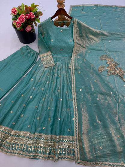 Close up view of detailed sequence embroidery work and fine stitching on sea green heavy fendy silk gown yoke - WishTown Fashion Club
