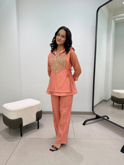 Front view of complete three piece peach beads embroidered co ord set displaying top pant and shrug - WishTown Fashion Club
