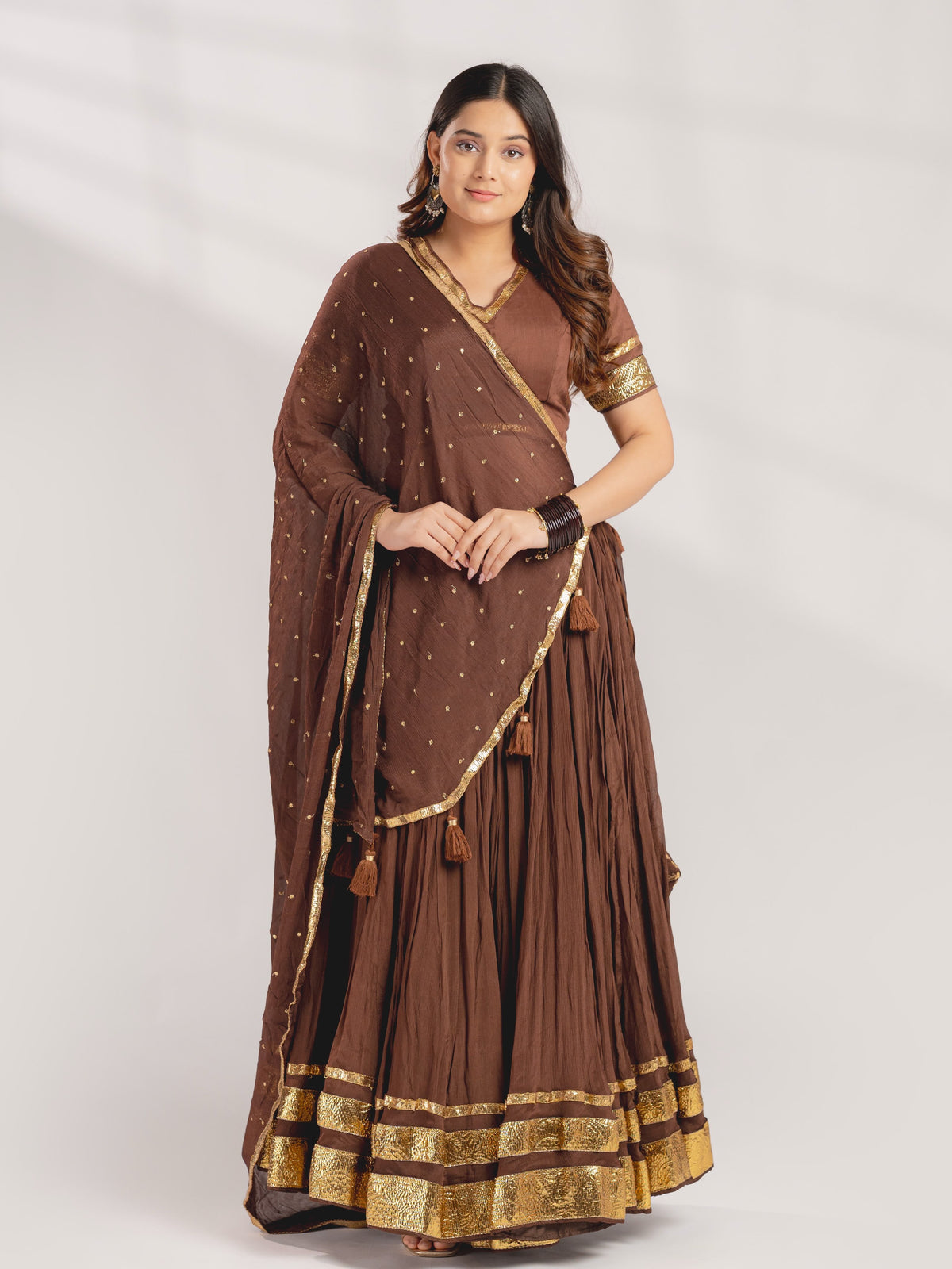 Close up view of traditional gotta patti work detailing on chocolate brown mul chanderi blouse yoke - WishTown Fashion Club