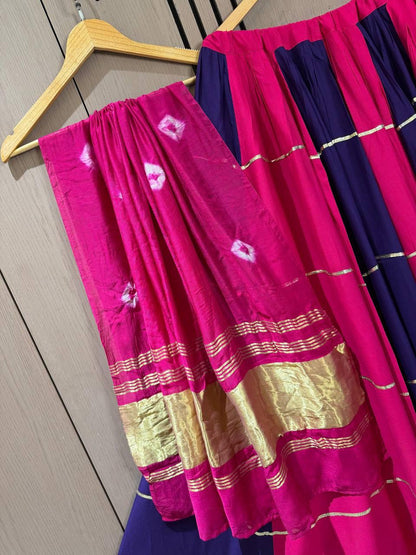 Side profile presentation of dark pink rayon lehenga showing six meter pleated full flair - WishTown Fashion Club