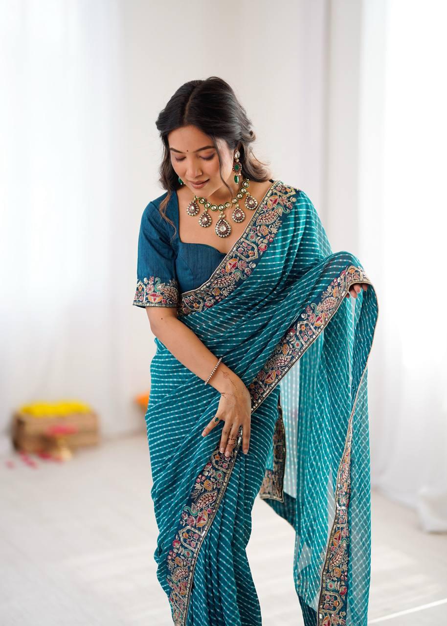 Close up view of detailed bandhani print and sparkling sequin embroidery on peacock blue georgette saree - WishTown Fashion Club