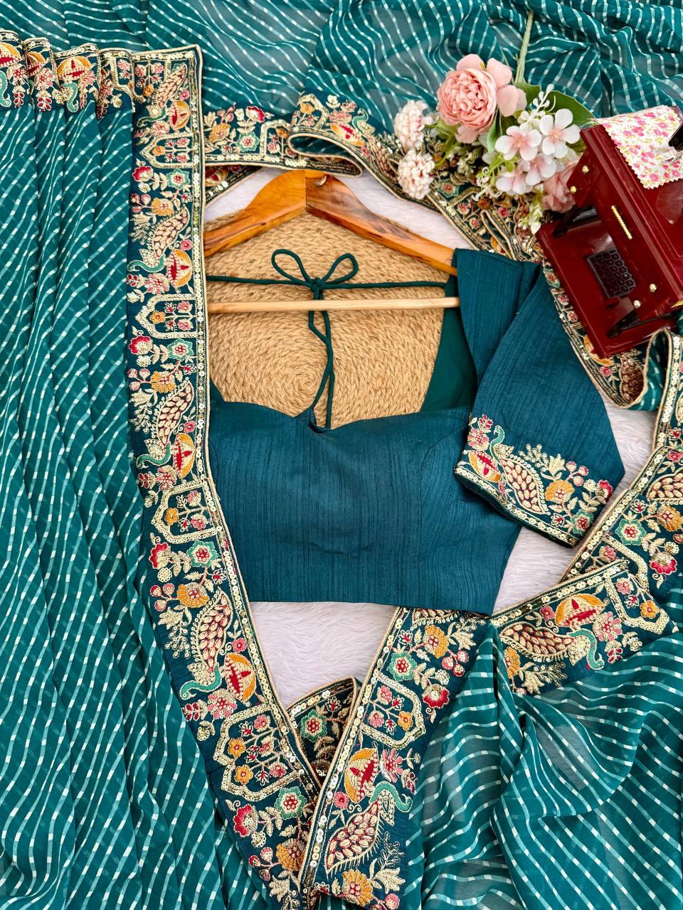 Side profile presentation of peacock blue faux georgette saree showing elegant sheen and lightweight fabric flow - WishTown Fashion Club