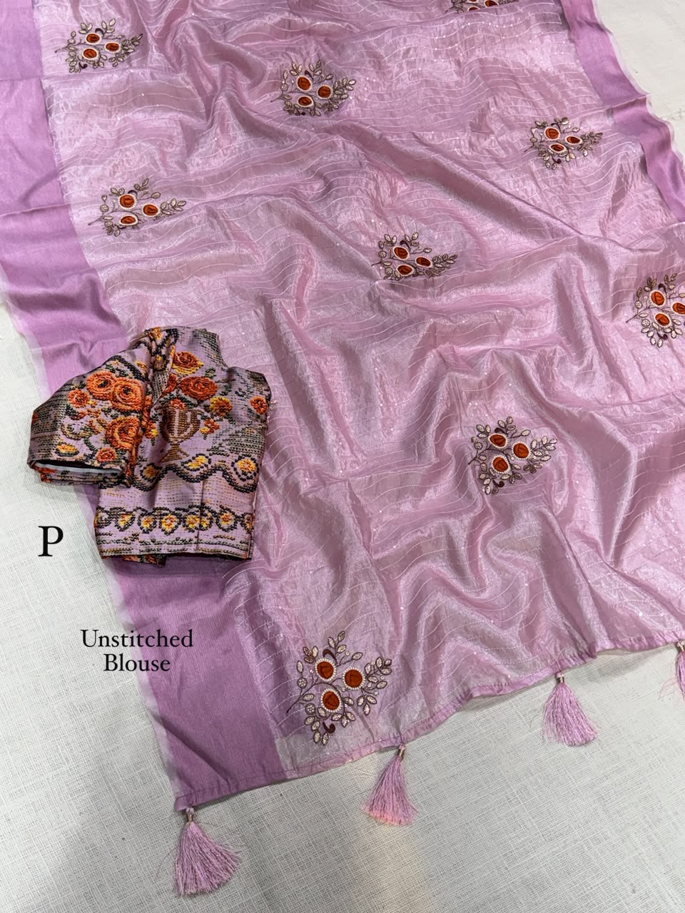Close up view of detailed blade cutwork border design on shimmering lavender tissue silk saree - WishTown Fashion Club