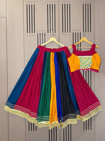 Back angle presentation of multi colour rayon mirror work gotta patti lehenga showing clean hemline finish - WishTown Fashion Club