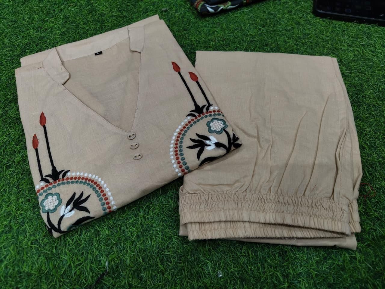 Women off white cotton co ord set with rich heavy embroidery detailing - WishTown Fashion Club