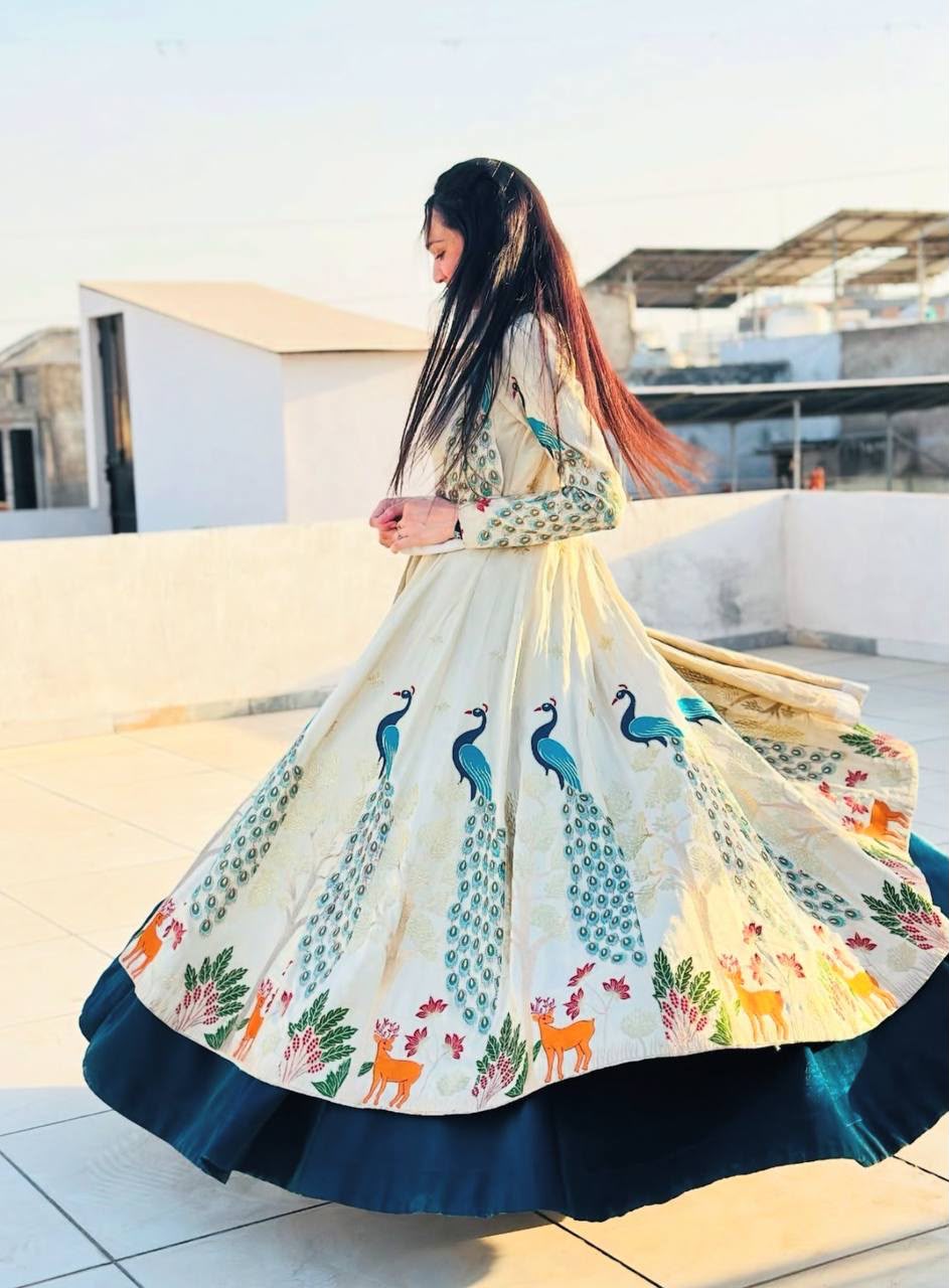 Back perspective of a fully stitched peacock blue festive dress highlighting the premium drape and soft micro cotton inner lining.