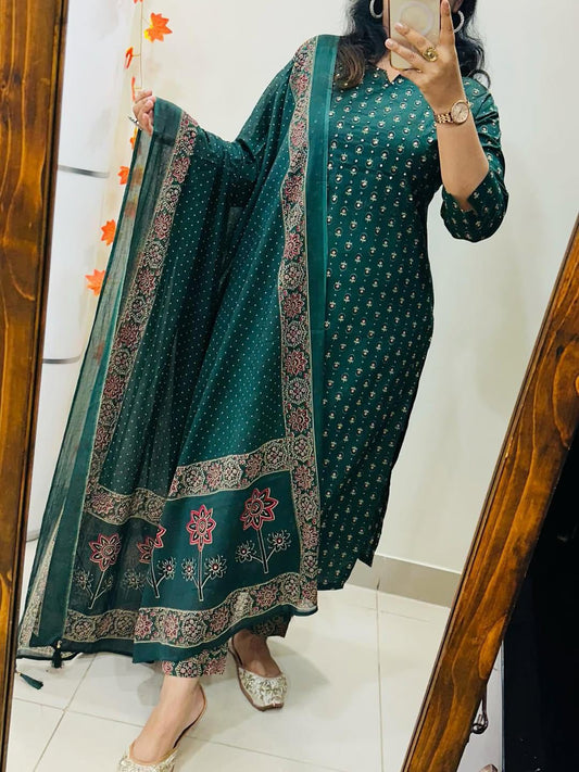 Front view of full three piece teal green traditional outfit featuring hand embroidered cotton tunic and matching straight pants.