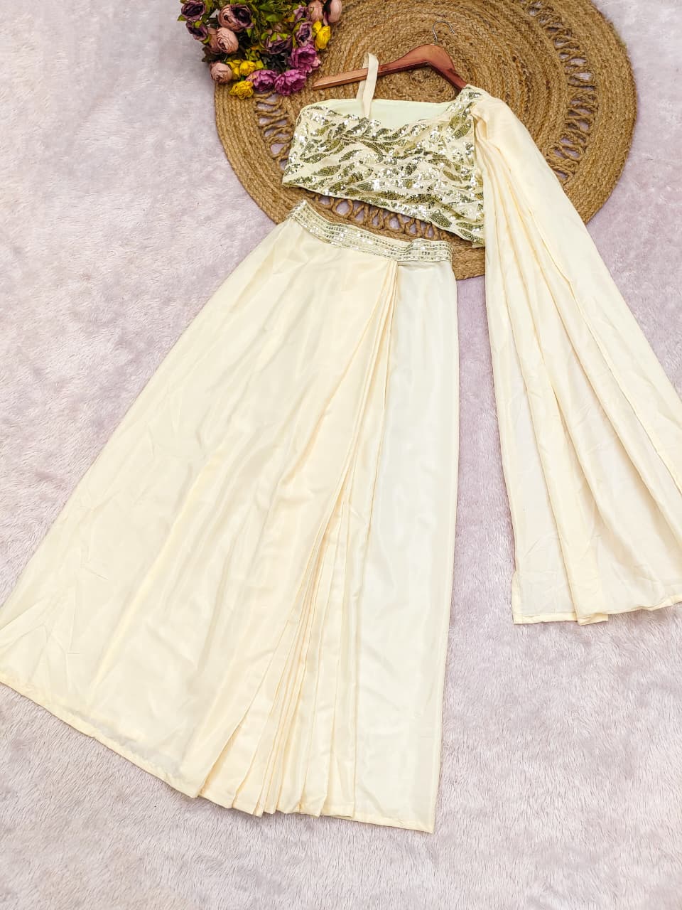 Flat layout of the modern cream designer fusion saree set displaying the fully stitched top and matching trousers