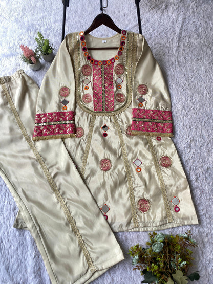 High resolution view of the off white cos moss palazzo trousers displaying matching real mirror work along the leg openings.