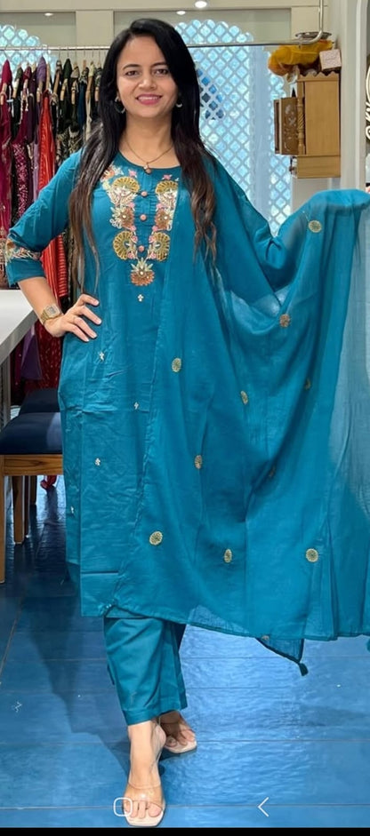 Front view of full three piece teal blue pure cotton super dying embroidery suit displaying a straight embroidered kurti pants and a malmal dupatta.