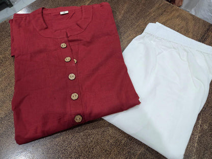 Side perspective presentation of the fully stitched maroon casual top highlighting the clean tailored seams and straight fit silhouette outline.