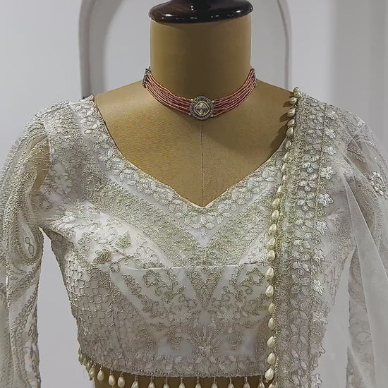 White net lehenga set showcasing full flare movement and embroidery video - WishTown Fashion Club