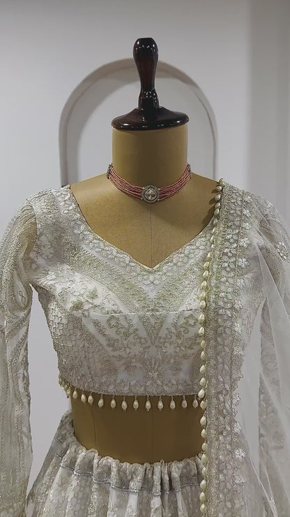 White net lehenga set showcasing full flare movement and embroidery video - WishTown Fashion Club