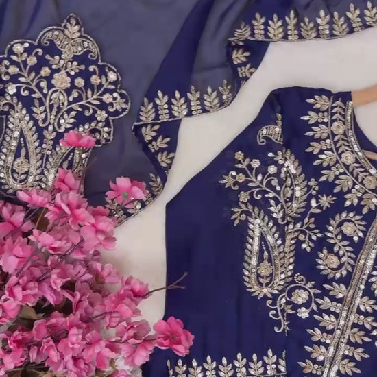 High definition retail display video highlighting the brilliant sparkle of five millimeter sequins and the fluid movement of the navy blue silk fabric.