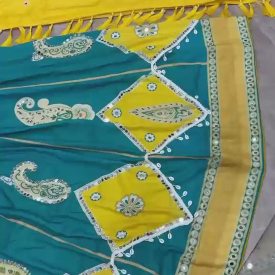 High definition retail showcase video displaying mirror shine and four meter flare twirl of deep cyan muslin silk lehenga - WishTown Fashion Club