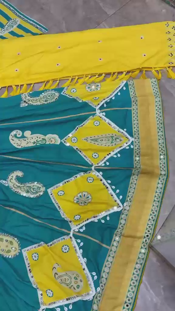 High definition retail showcase video displaying mirror shine and four meter flare twirl of deep cyan muslin silk lehenga - WishTown Fashion Club