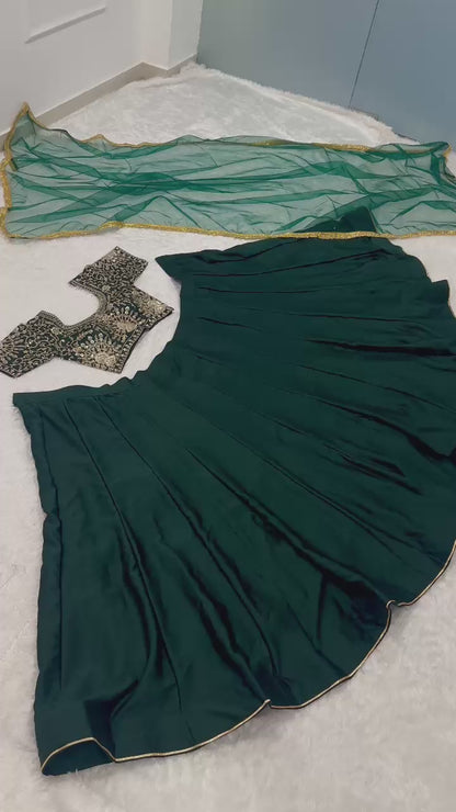 Elegant green satin lehenga with 4.5 meter flair and net dupatta with border embellishment – WishTown Fashion Club