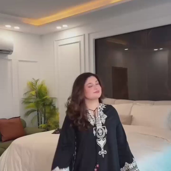 Studio product demonstration video highlighting the full coverage sleeve pattern and the effortless fluid drape of the digital print dupatta under warm lights.