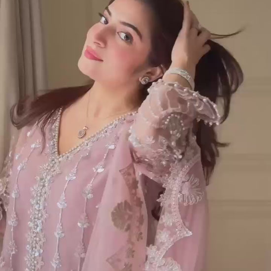 Product demonstration video highlighting the smooth movement of the soft net material and the premium shine of dusty rose embroidery under lights.