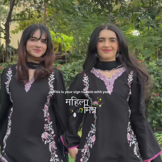 High definition retail display video highlighting the premium quality shine of the heavy embroidery work and the smooth movement of the black fabric under warm studio lights.