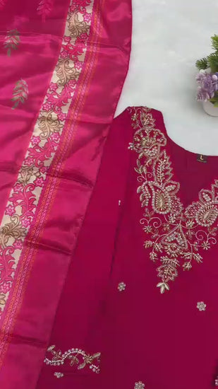 Product demonstration video highlighting the smooth fabric texture and the elegant shimmer of hand embroidery work under warm studio lighting.