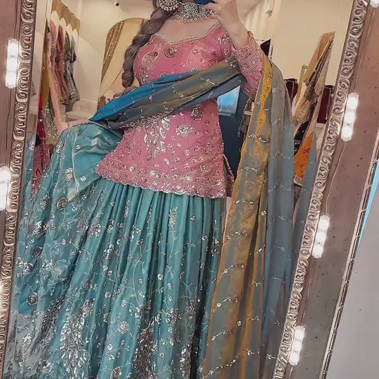 High definition retail display video highlighting the brilliant sparkle of mixed size sequence embroidery and the effortless movement of the coral pink crushi silk top.