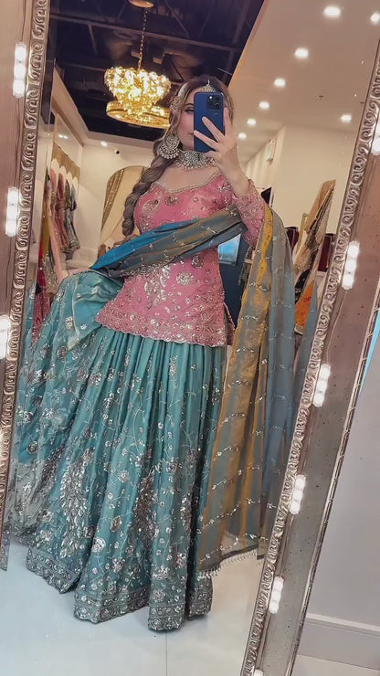 High definition retail display video highlighting the brilliant sparkle of mixed size sequence embroidery and the effortless movement of the coral pink crushi silk top.