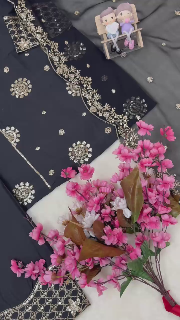 Close up video rotation highlighting the sparkling texture of metallic thread embroidery under warm festive lighting.