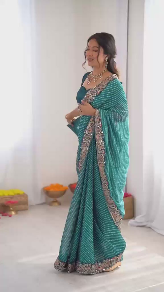 Studio product review video highlighting drape fluidity of five point five meter peacock blue georgette saree - WishTown Fashion Club
