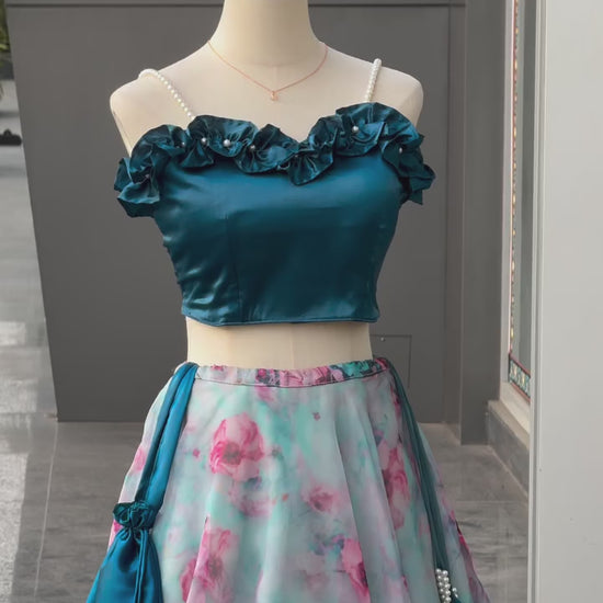High definition retail display video highlighting the massive sweeping movement of the eight meter flair sky blue organza silk lehenga skirt during a full rotation.