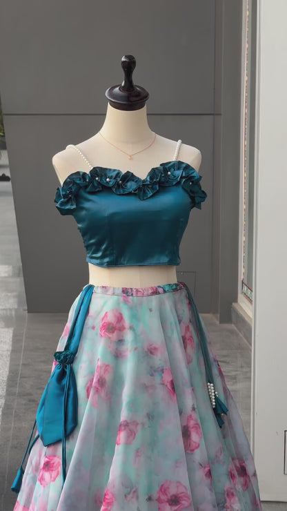 High definition retail display video highlighting the massive sweeping movement of the eight meter flair sky blue organza silk lehenga skirt during a full rotation.