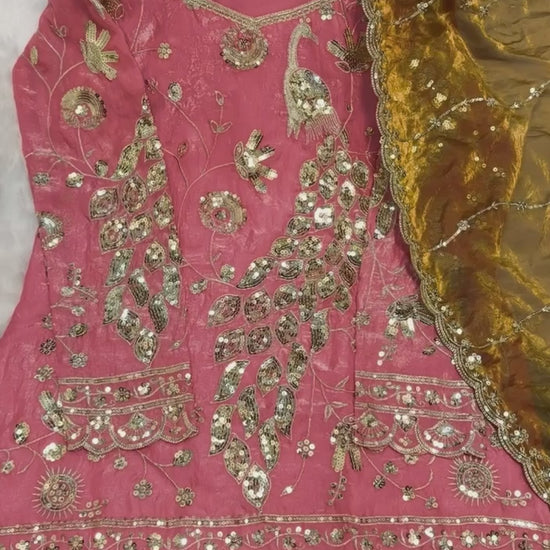 Studio product demonstration video highlighting the full coverage sleeve pattern and the sweeping fluid motion of the flared coral pink sharara pants under lights.