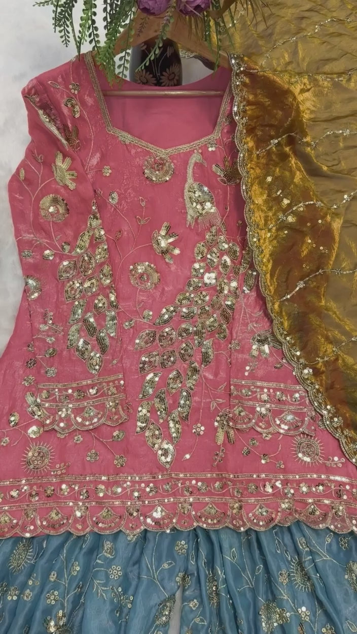 Studio product demonstration video highlighting the full coverage sleeve pattern and the sweeping fluid motion of the flared coral pink sharara pants under lights.