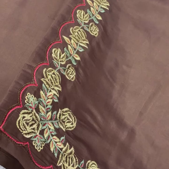 Studio product demonstration video highlighting the dangling latkan design patterns and the effortless fluid drape of the chocolate brown silk suit.