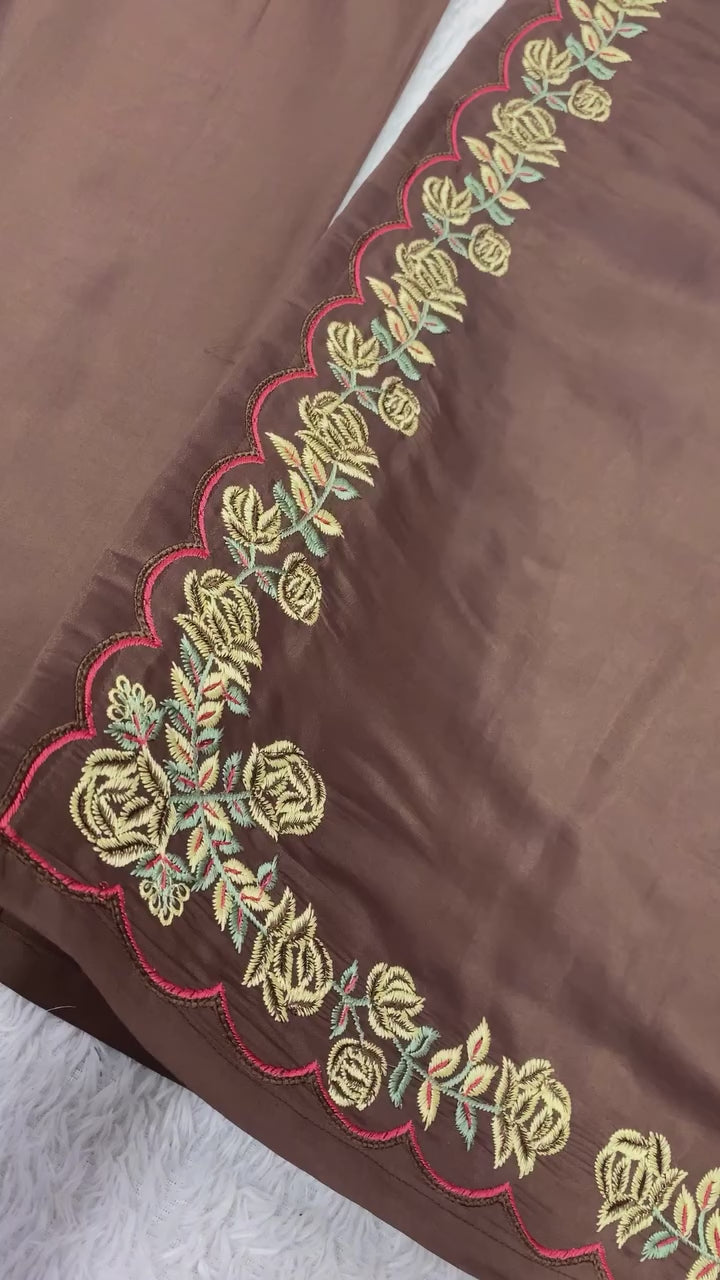 Studio product demonstration video highlighting the dangling latkan design patterns and the effortless fluid drape of the chocolate brown silk suit.