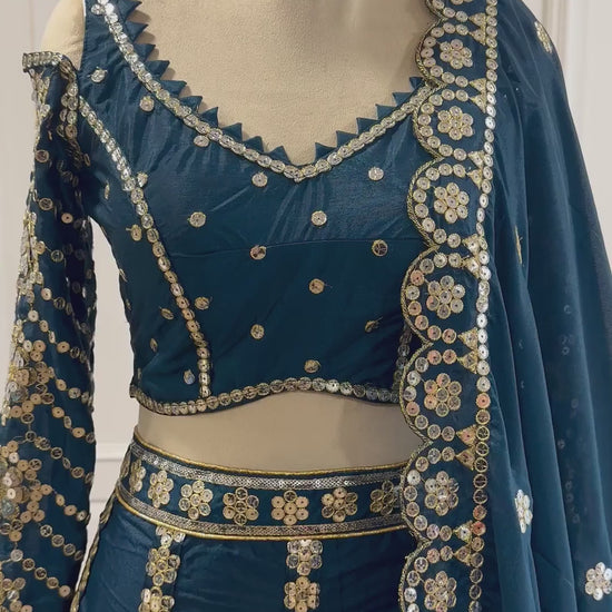 Teal blue designer lehenga choli video showing sequins and zari detailing - WishTown Fashion Club