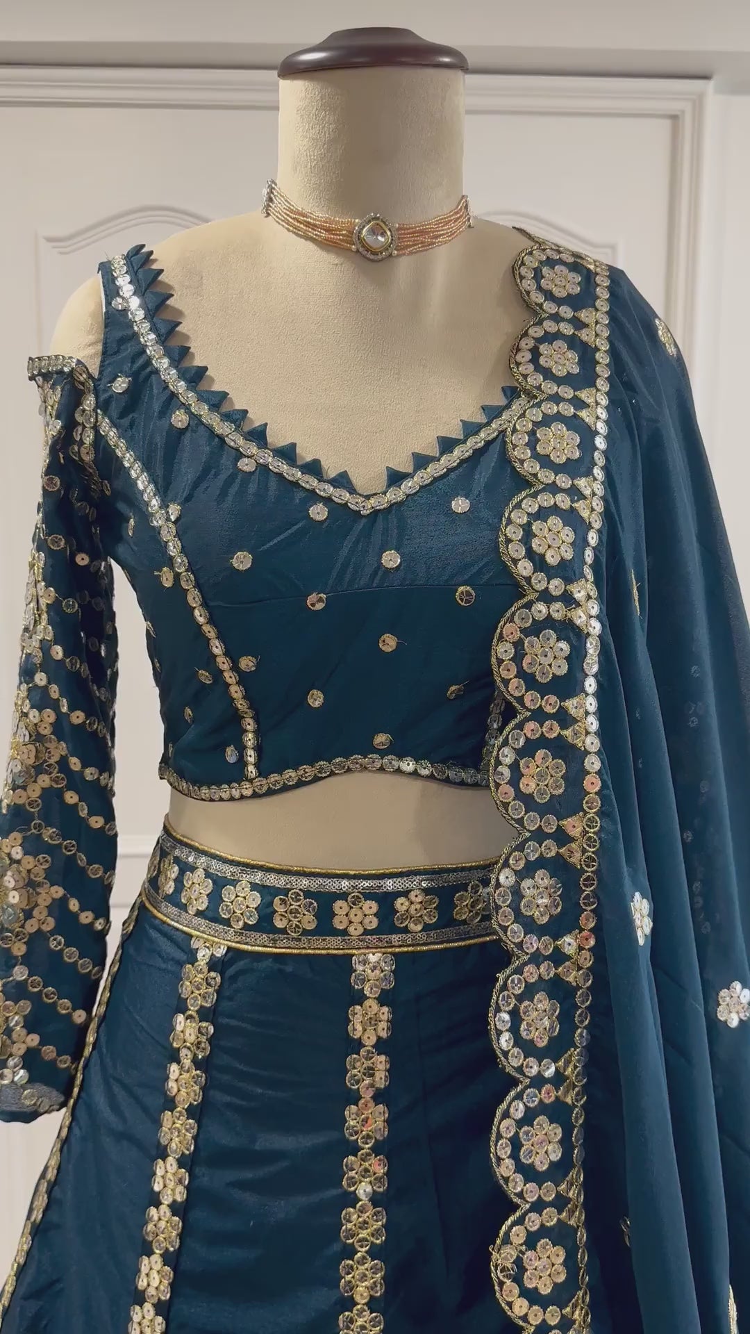 Teal blue designer lehenga choli video showing sequins and zari detailing - WishTown Fashion Club