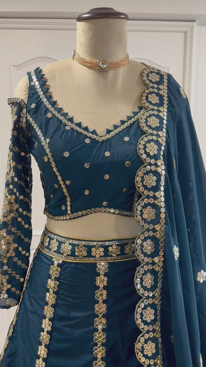 Teal blue designer lehenga choli video showing sequins and zari detailing - WishTown Fashion Club