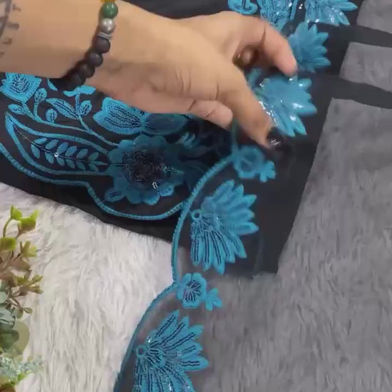 Studio product demonstration video highlighting the premium quality cloth surface and elegant flowing motion of the blue ethnic dress.