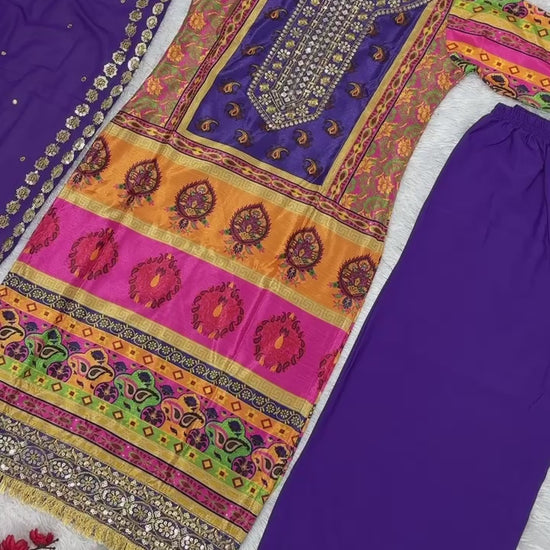 High definition retail display video highlighting the premium quality shine of sequence embroidery and the fluid movement of the printed purple georgette material.