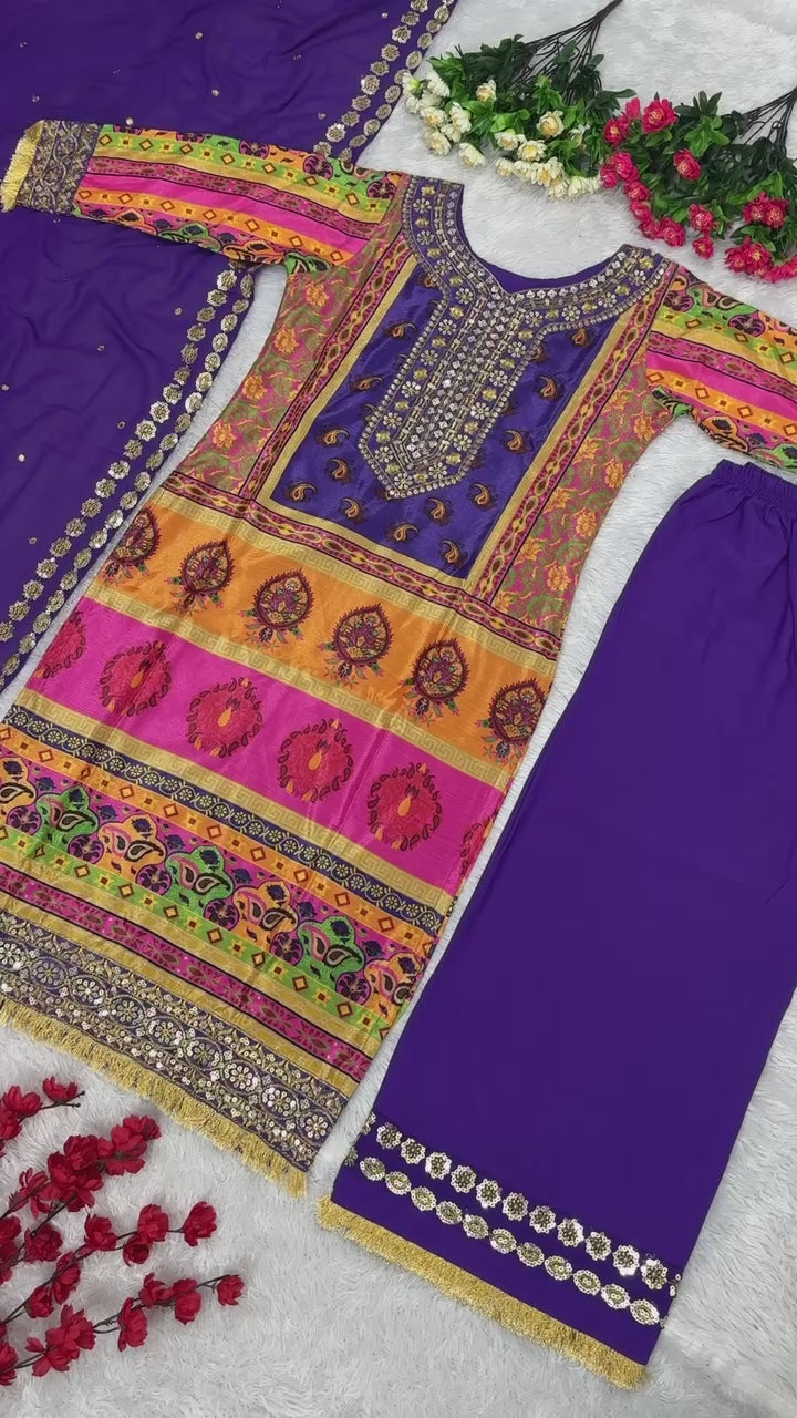 High definition retail display video highlighting the premium quality shine of sequence embroidery and the fluid movement of the printed purple georgette material.
