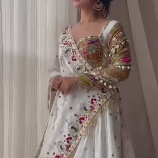 High definition retail showcase video displaying mirror shine and four meter flare twirl of white muslin silk lehenga - WishTown Fashion Club